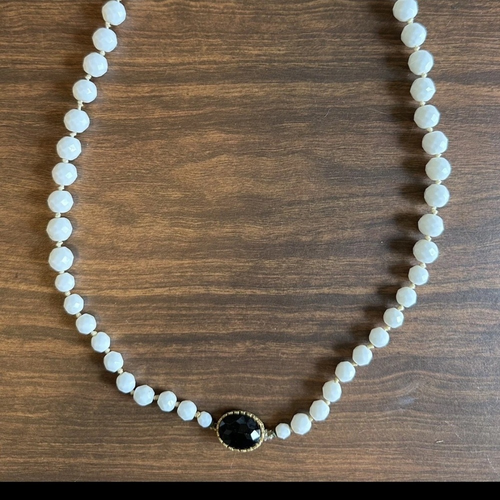 Elegant White Beaded Necklace with Black Gem